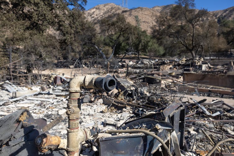A burned area with a blackened pipe.