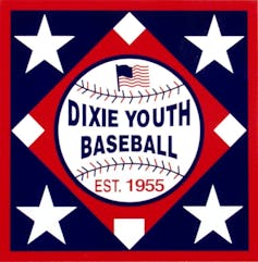 A baseball with an American flag superimposed over it, surrounded by four stars.