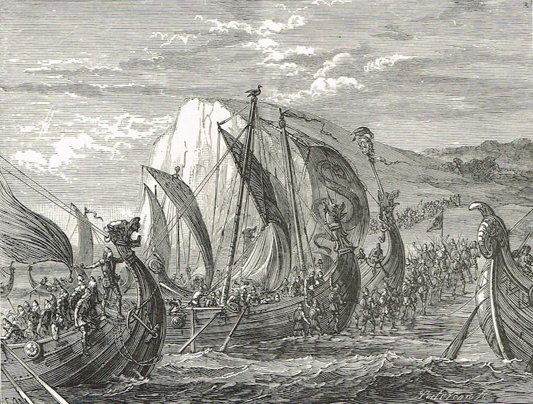 An etching of Viking ships landing on an English shore for the first time.
