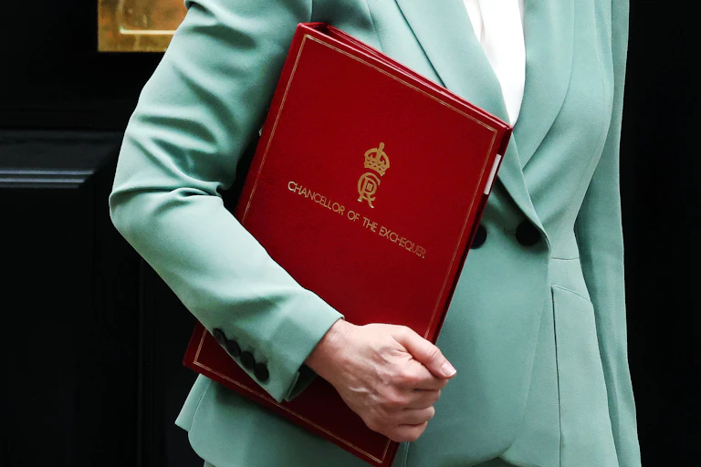 uk chancellor rachel reeves leaving downing street carrying her red chancellor folder