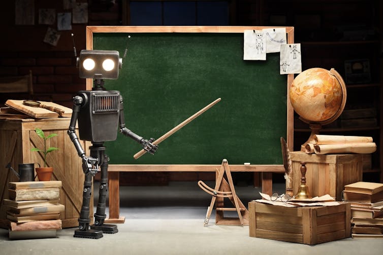 Robot teacher in front of a blackboard