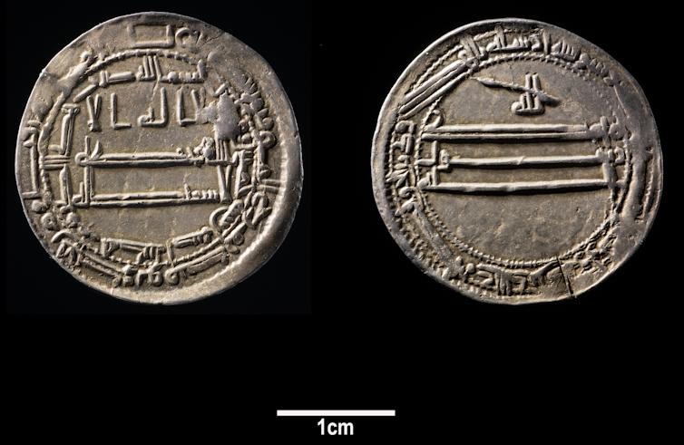 Two silver dirham coins.
