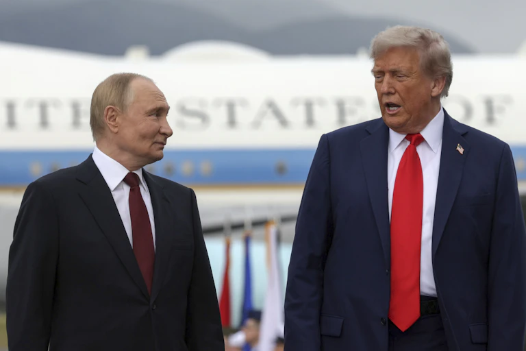 The US president, Donald Trump, and his Russian counterpart Vladimir Putin pose for a photo in front of Air Force One.