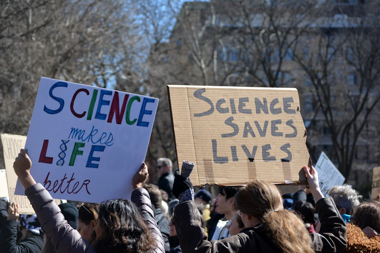 People holding up pro-science placards.