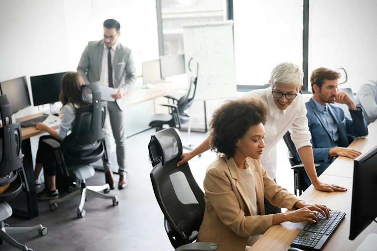 People working in an open-plan office
