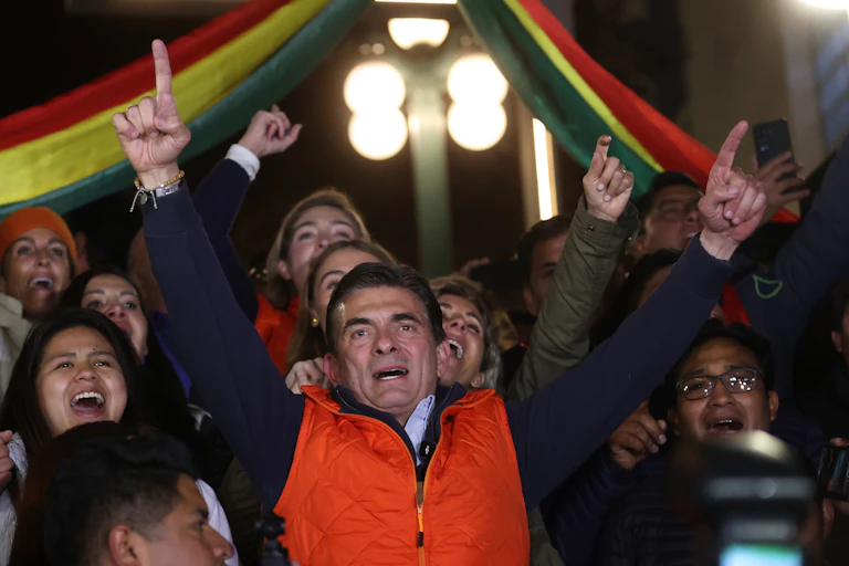 Rodrigo Paz Pereira celebrates with supporters.