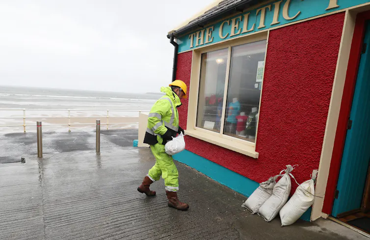 Sandbags, with storm sea in background