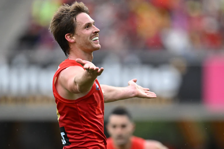 Noah Anderson of the Suns reacts after kicking a goal against the Lions.