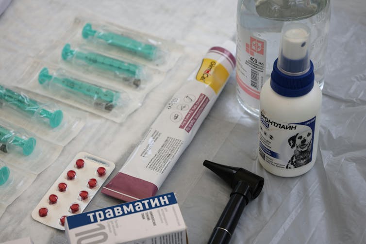 Pet medications on a white table.