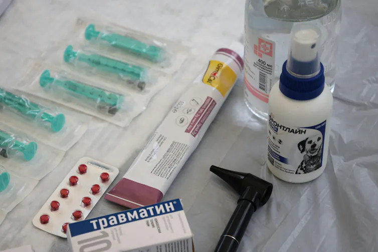 Pet medications on a white table.