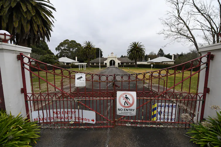 a locked gate at a closed firefighting facility due to pollution.