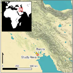 A map of southern Iraq pinpointing the area of study in Basra, near the ocean, with a smaller map inlaid showing the region to the right of the top of Africa.