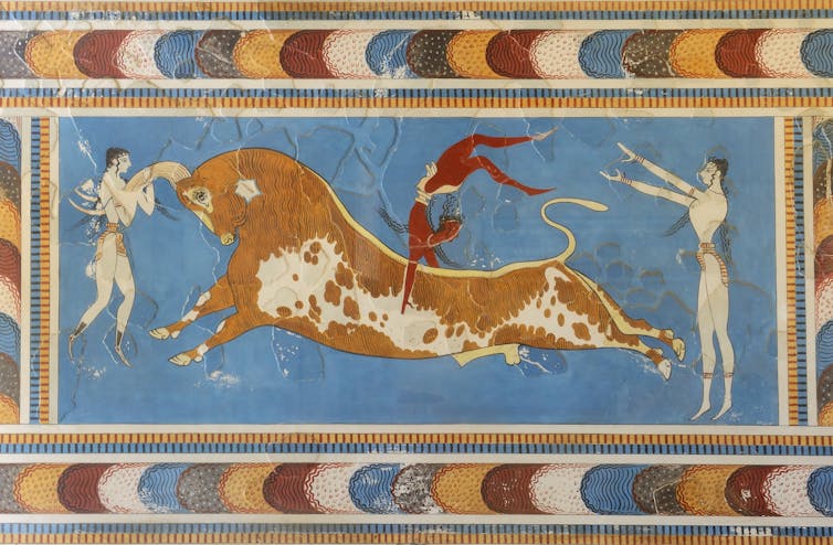 Fresco showing two people and a bull