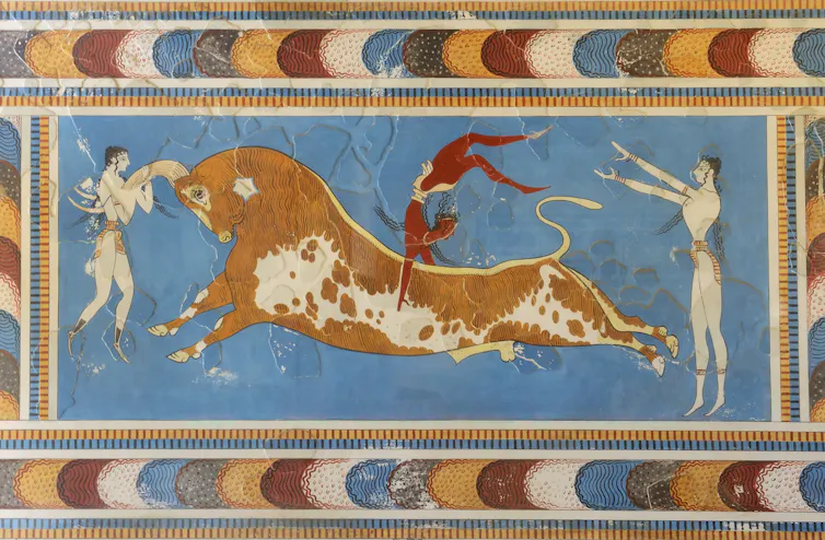 Fresco showing two people and a bull