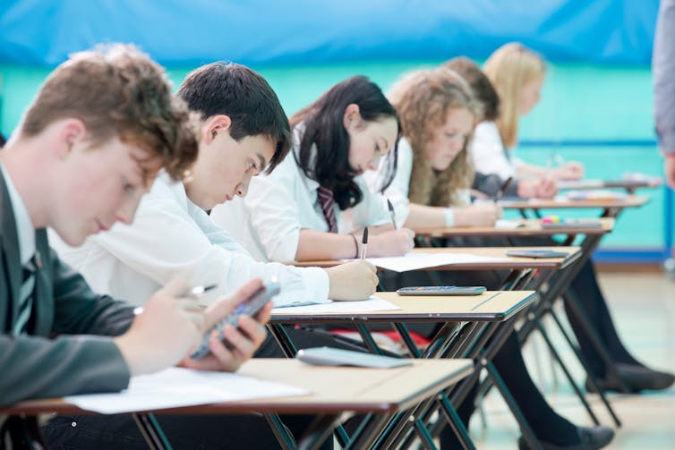 Teenagers in exam hall