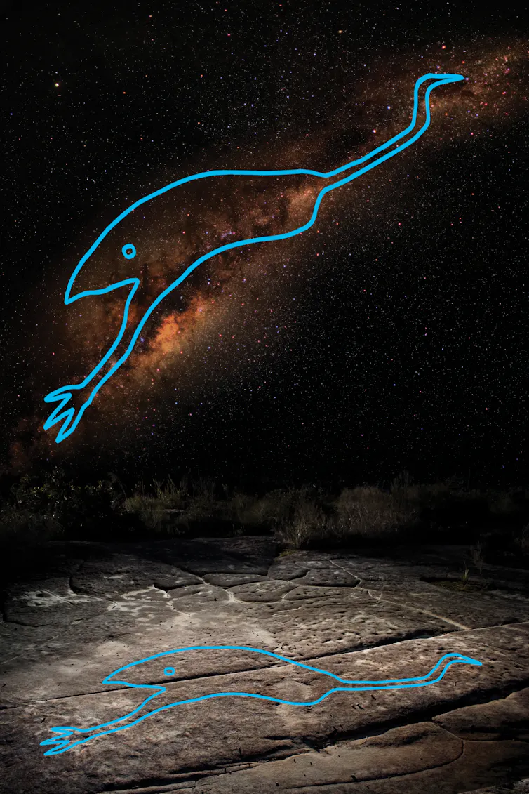 Image of the night sky with the milky way and a trace of an emu in blue colour.