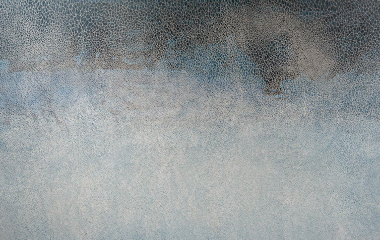 A textured abstract painting in greys, blues and white.