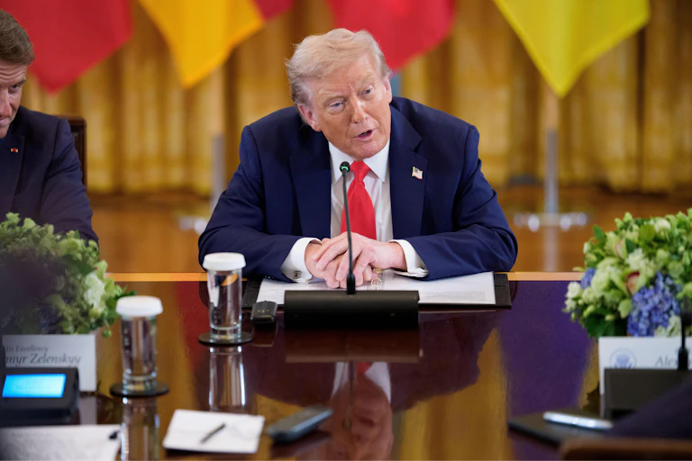 Donald Trump speaks during a meeting with European leaders in the White House.