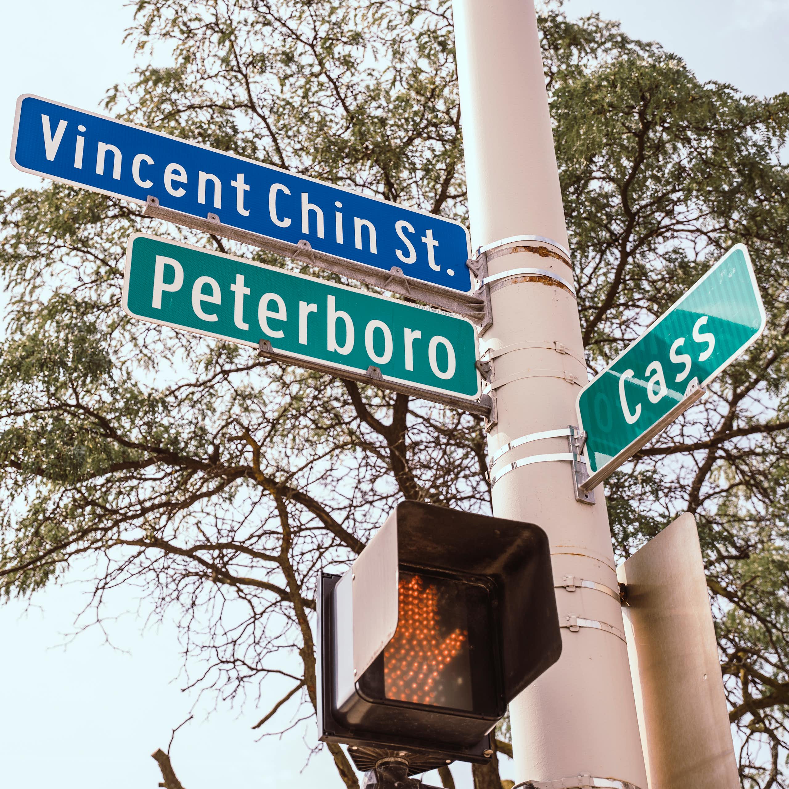 A street sign reads "Vincent Chin St." "Peterboro" and "Cass"