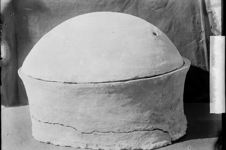 Black and white photo of pottery tomb