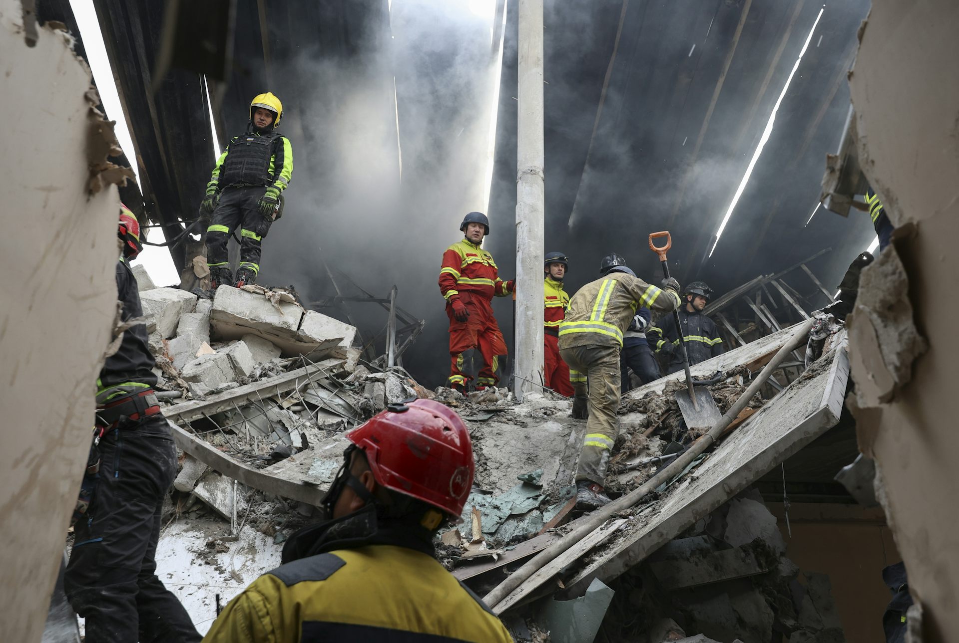 Ukrainian rescue workers at the site of a drone strike.