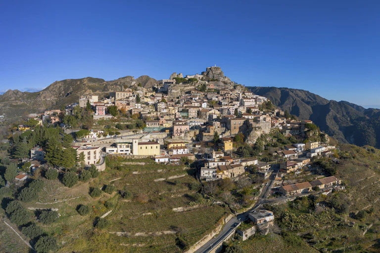 An ancient Italian village perched on a steep mountainside.