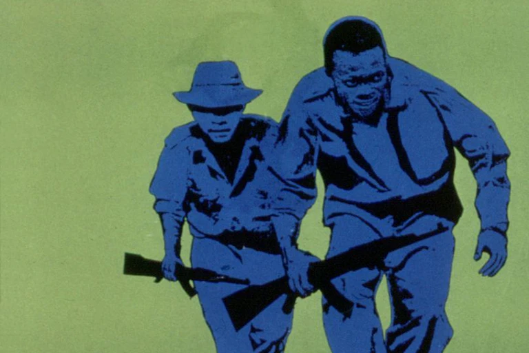 Image of two armed people running