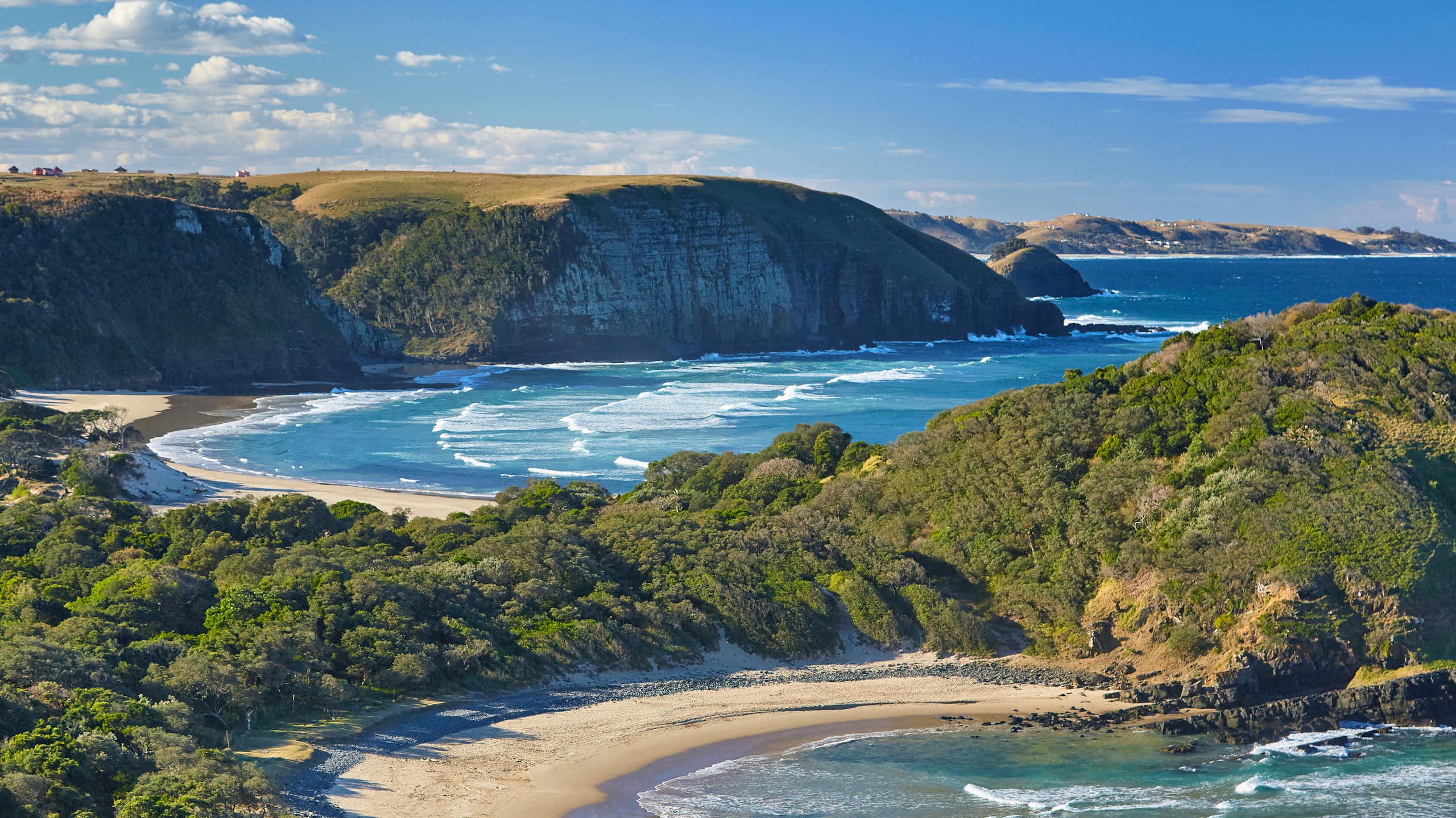 A large stretch of coastline showing the bright blue Indian Ocean