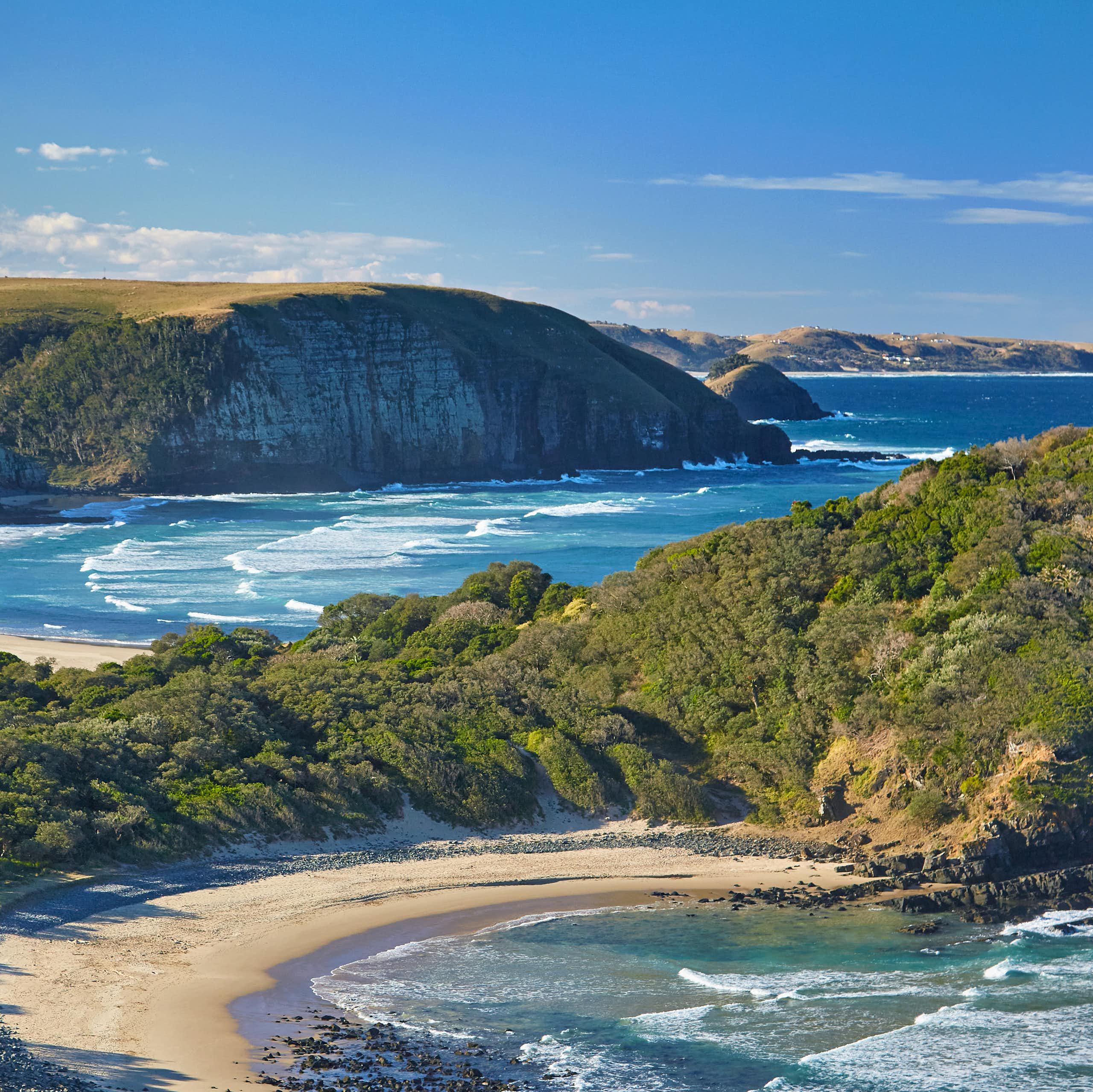 A large stretch of coastline showing the bright blue Indian Ocean