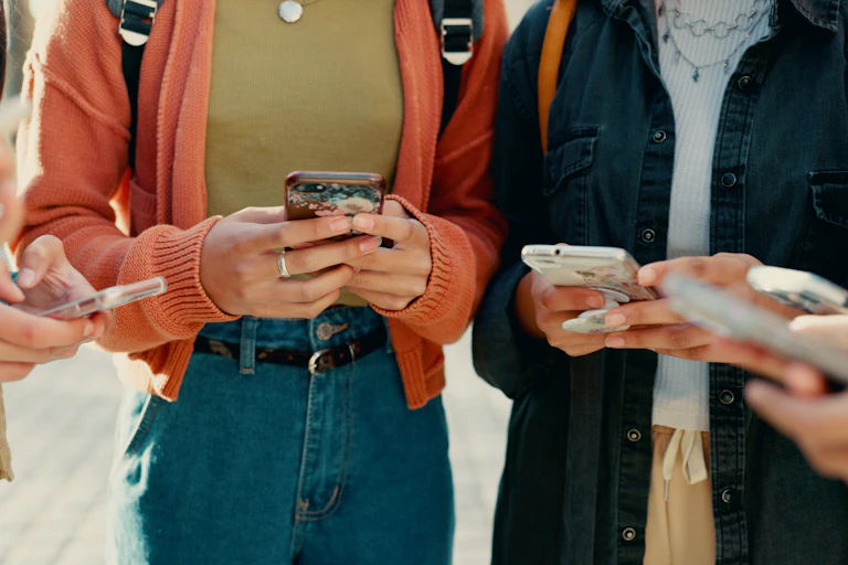 young people holding smarrtphones