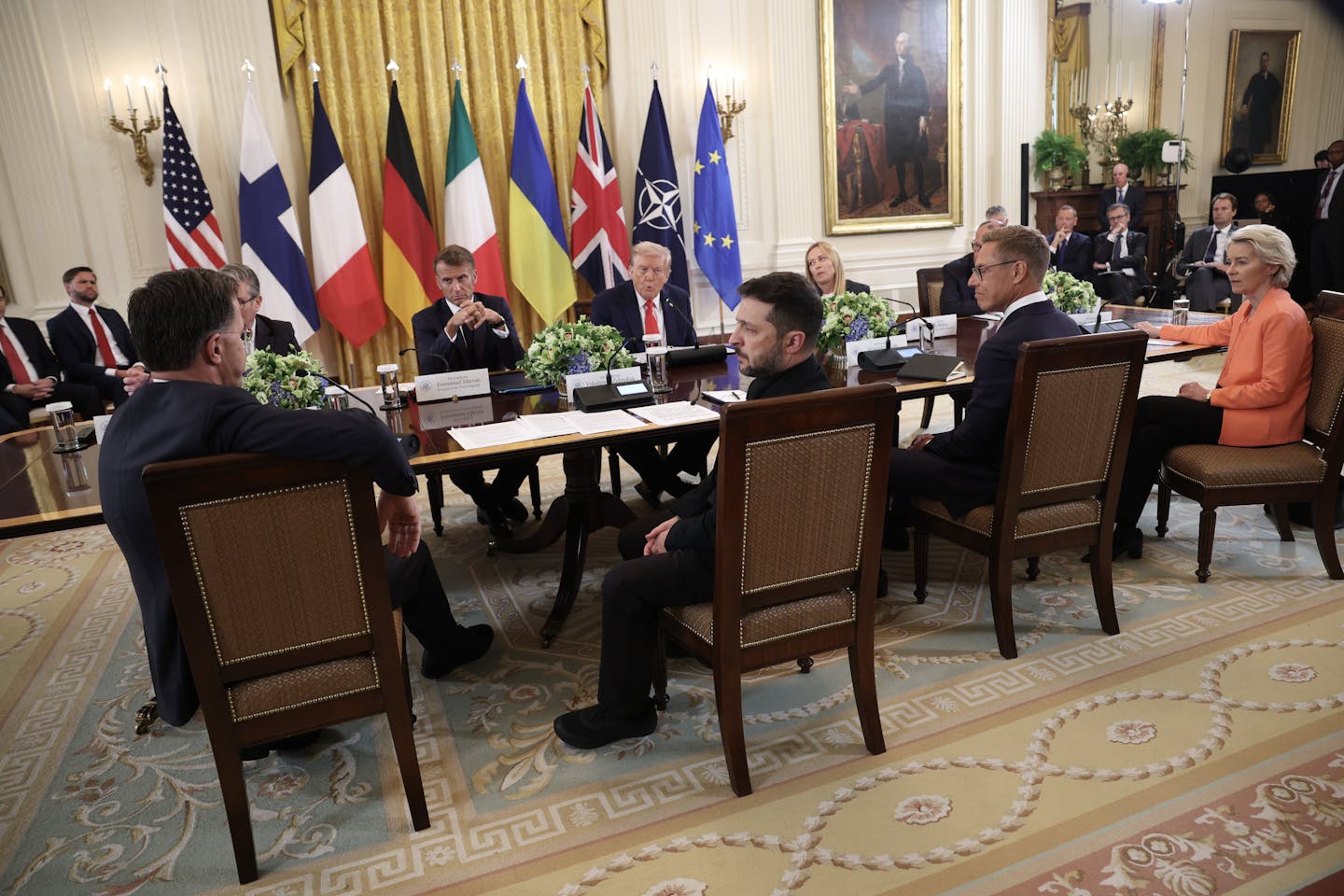 People sit around a conference table.