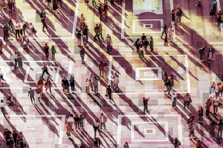 Aerial photo of people walking across a plaza