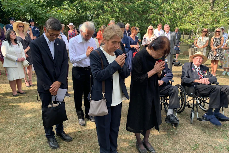 The descendants of fighters in the Burma Campaign pratice _irei_ at the 80th VJ day commemoration.