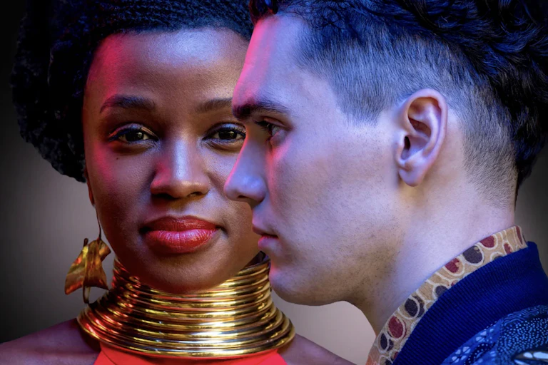 A young man and woman facing in different directions