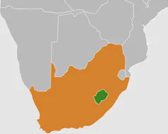 A map of the lower end of a continent showing a small green shape in the south surrounded by a large orange shape.