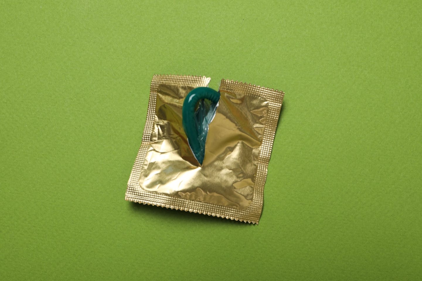 A condom in gold packaging.