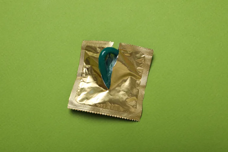 A condom in gold packaging.