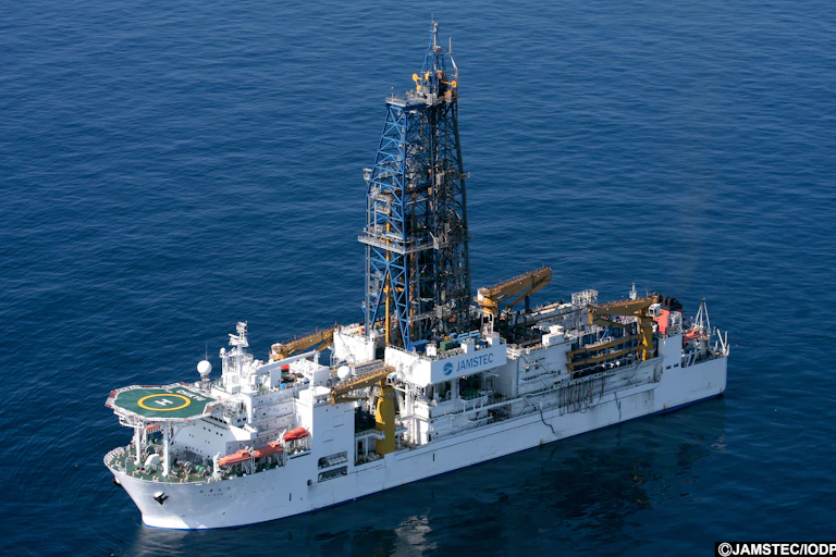 a large drilling ship on open water