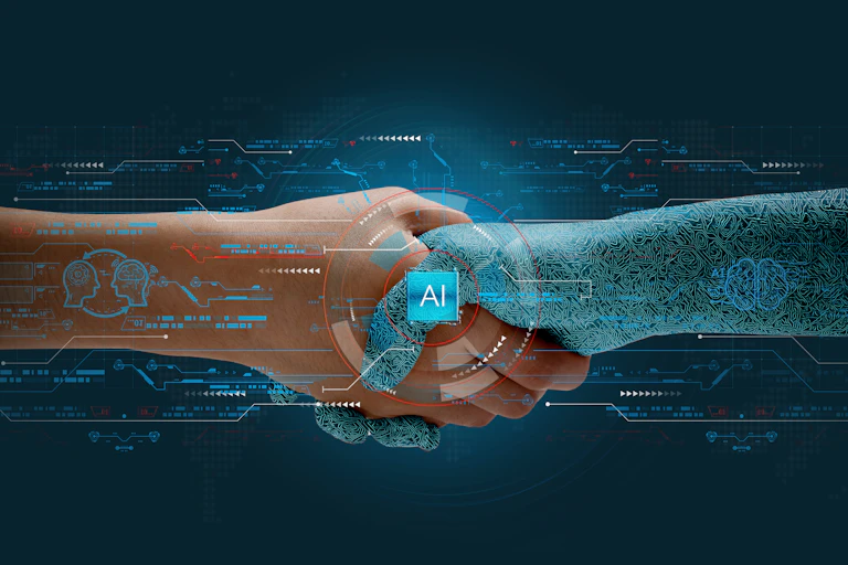 Human shakes hands with AI to show partnership.