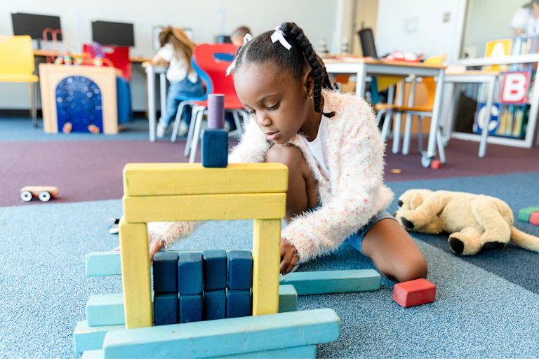 Girl plays at childcare