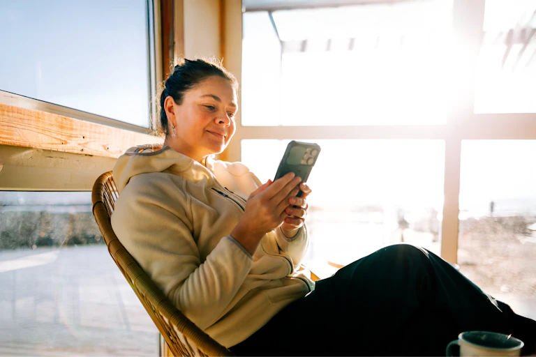 Woman in her 40s scrolls social media