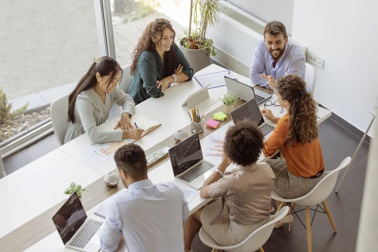Business people have a meeting around a table in a modern office.