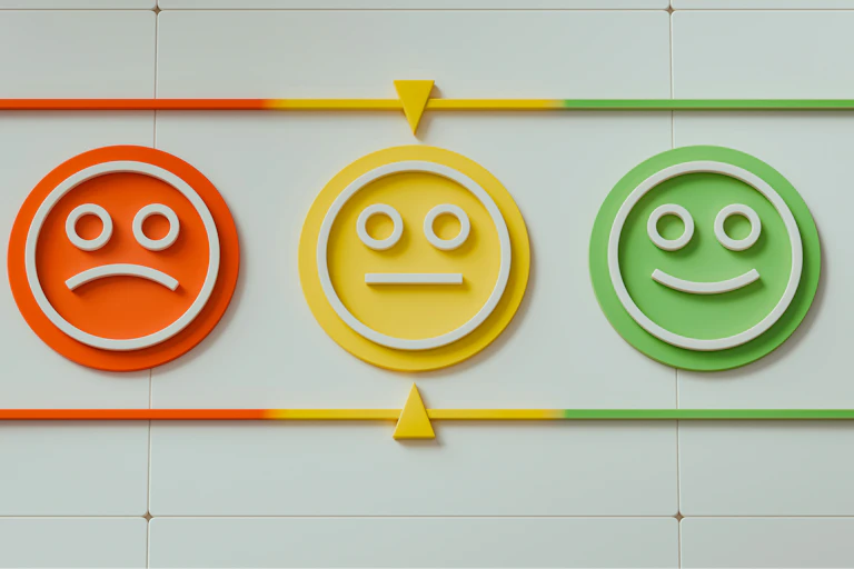 Three faces, one unhappy, one neutral and one smiling.