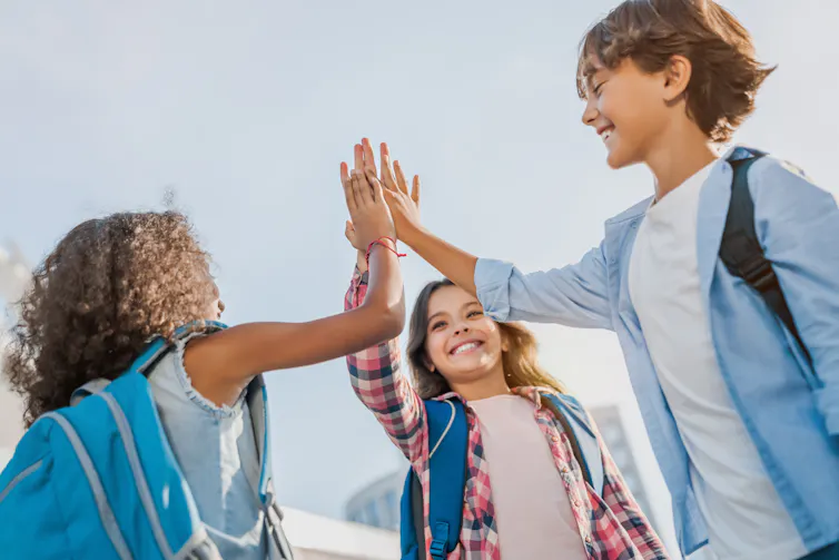 Children high fiving
