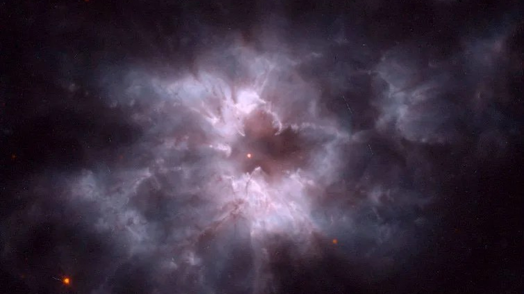 An irregular glowing cloud in space, with a star in the middle.