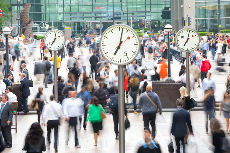 blurred image of commuters in a uk railway station