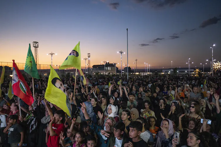 A crowd gathers at a rally.