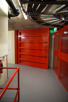 A red metal blast door.