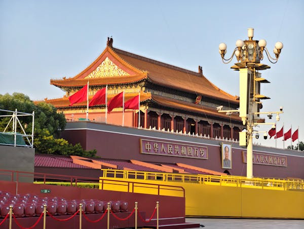 A pagoda-style building is seen in the sunlight.