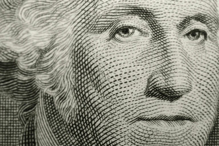 A white-haired man's face, with the top and bottom cut off.
